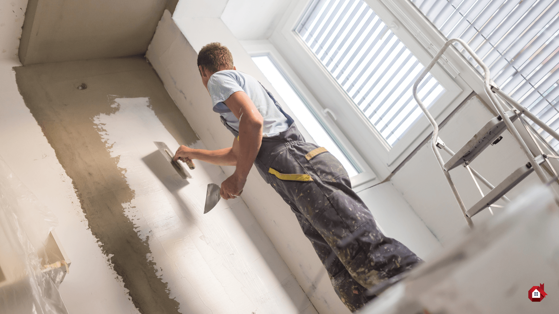 contractor plastering the wall