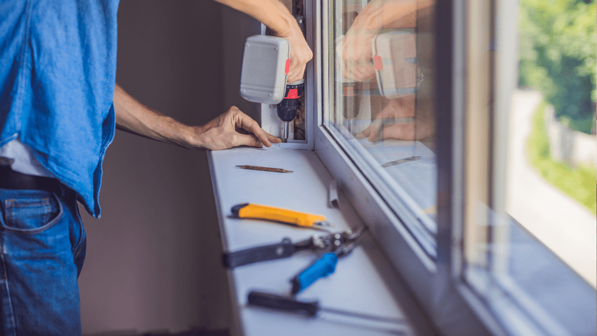 Contractor installing a window