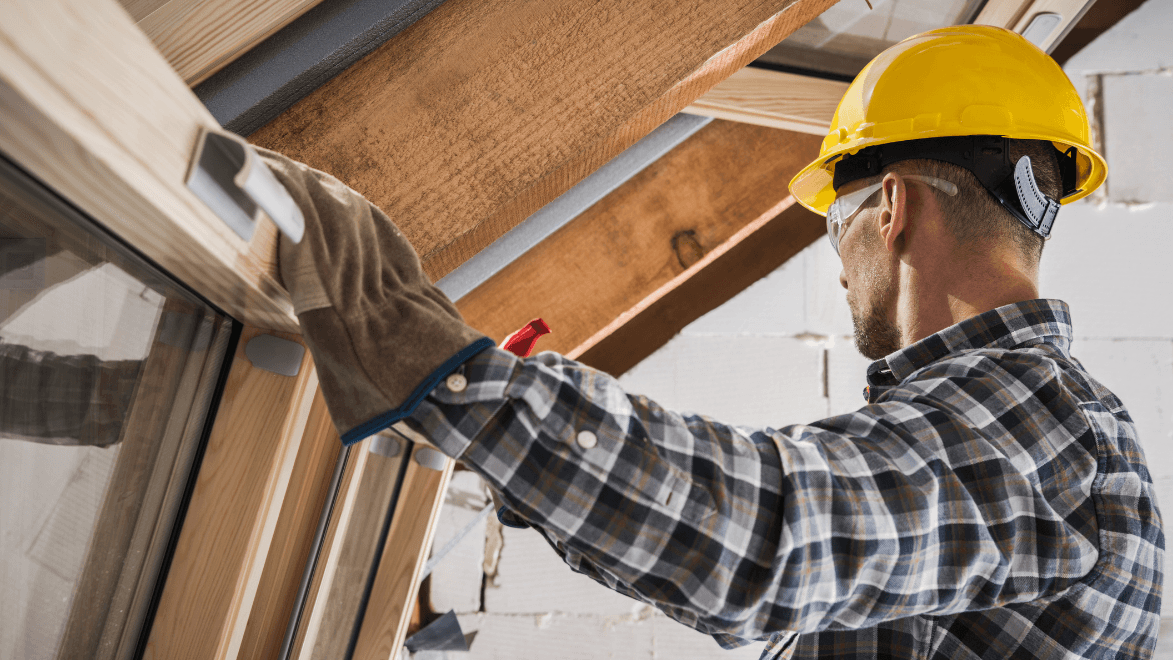 Contractor installing a window