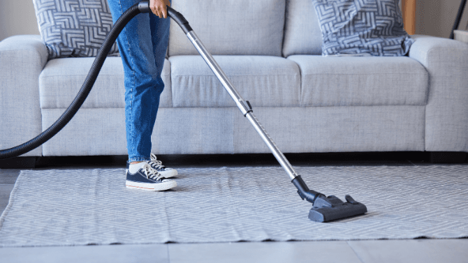 Person vacuuming