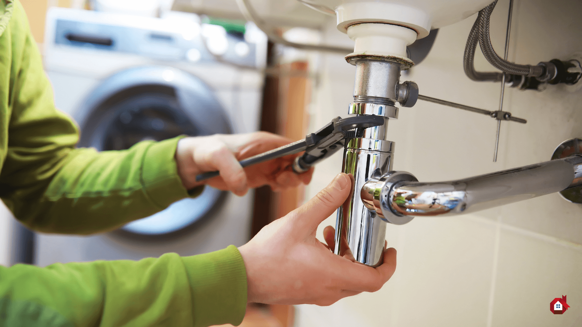 contractor repairs sink plumbing