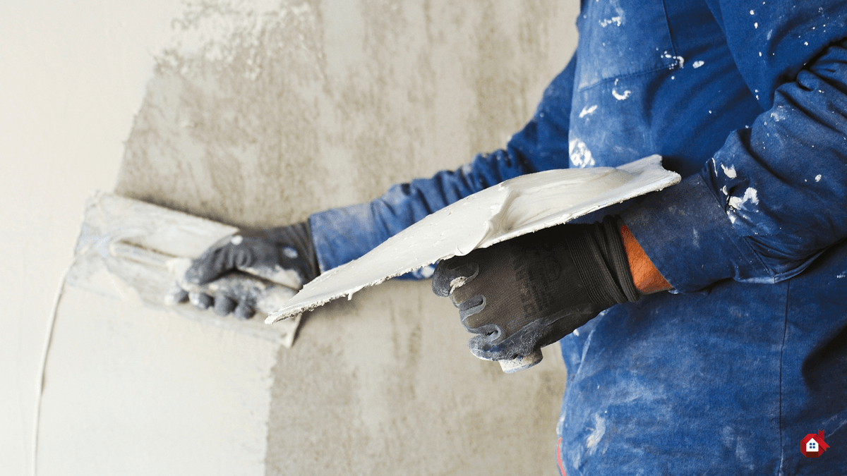 contractor plastering the wall