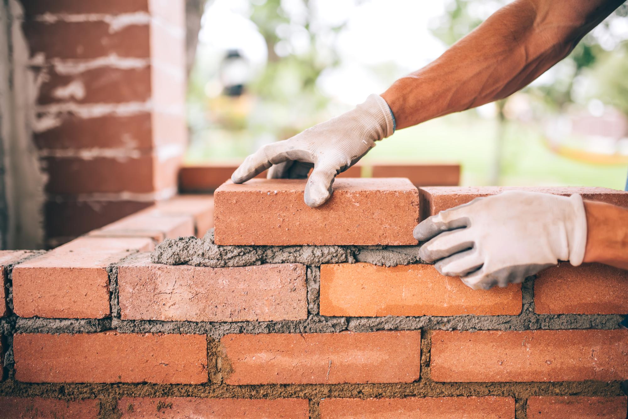 Laying brick as a material used in masonry work